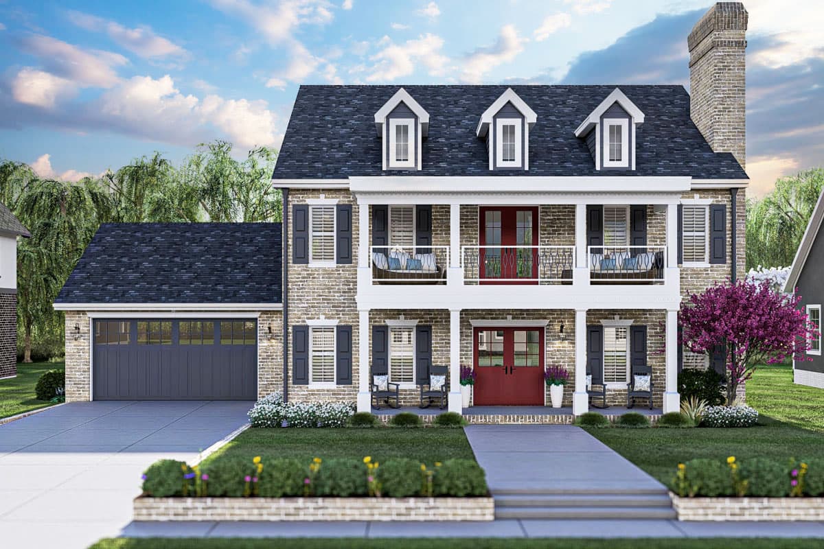 House plan exterior. Two-story Colonial with brick facade, front porch, dormers, and a detached garage with a dark gray door.