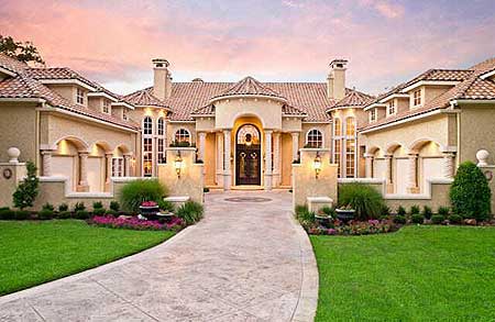 House plan exterior: Mediterranean style, two stories, arched entryway, tiled roof, multiple gables, and decorative quoins.