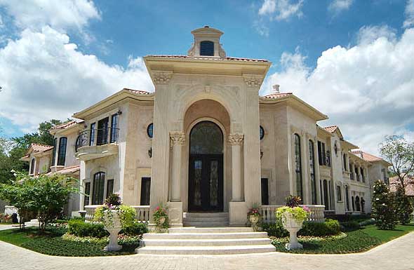 House plan exterior: Large, two-story Mediterranean-style residence with ornate columns, arched entryway, and multiple balconies.