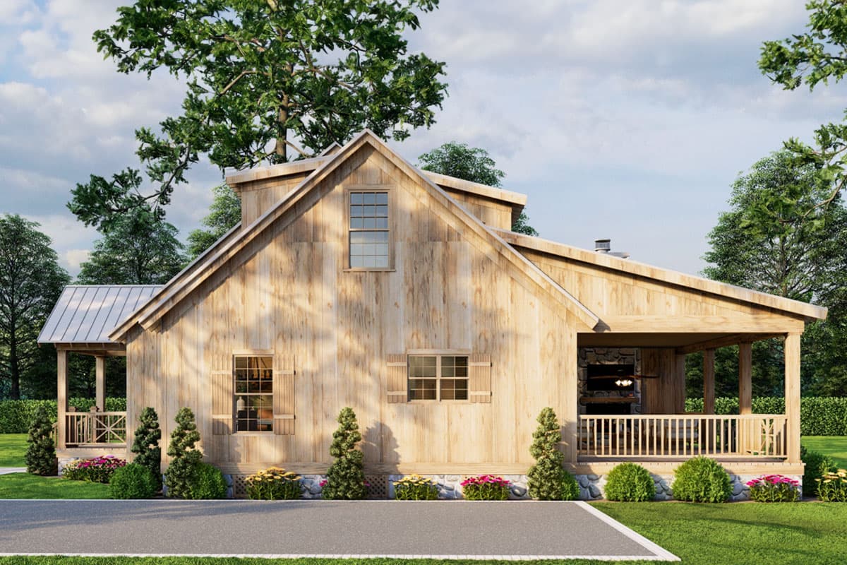 Modern Farmhouse house plan exterior with wood siding, metal roof, front porch, and covered outdoor living area with fireplace.
