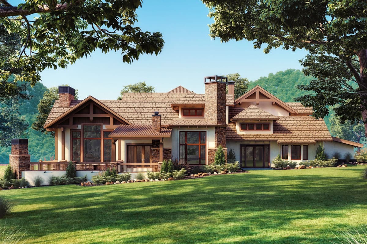 House plan exterior: Lodge style with stone chimney, exposed beams, multi-level rooflines, and a wraparound porch.