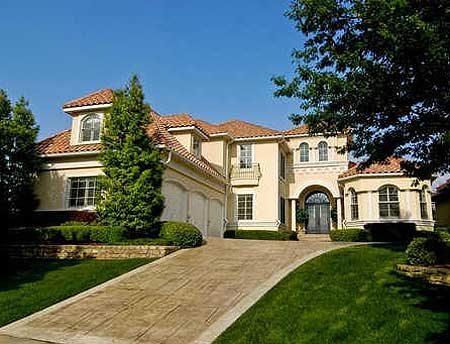 House plan exterior of a two-story Mediterranean-style home with a tiled roof, arched entryway, and three-car garage.