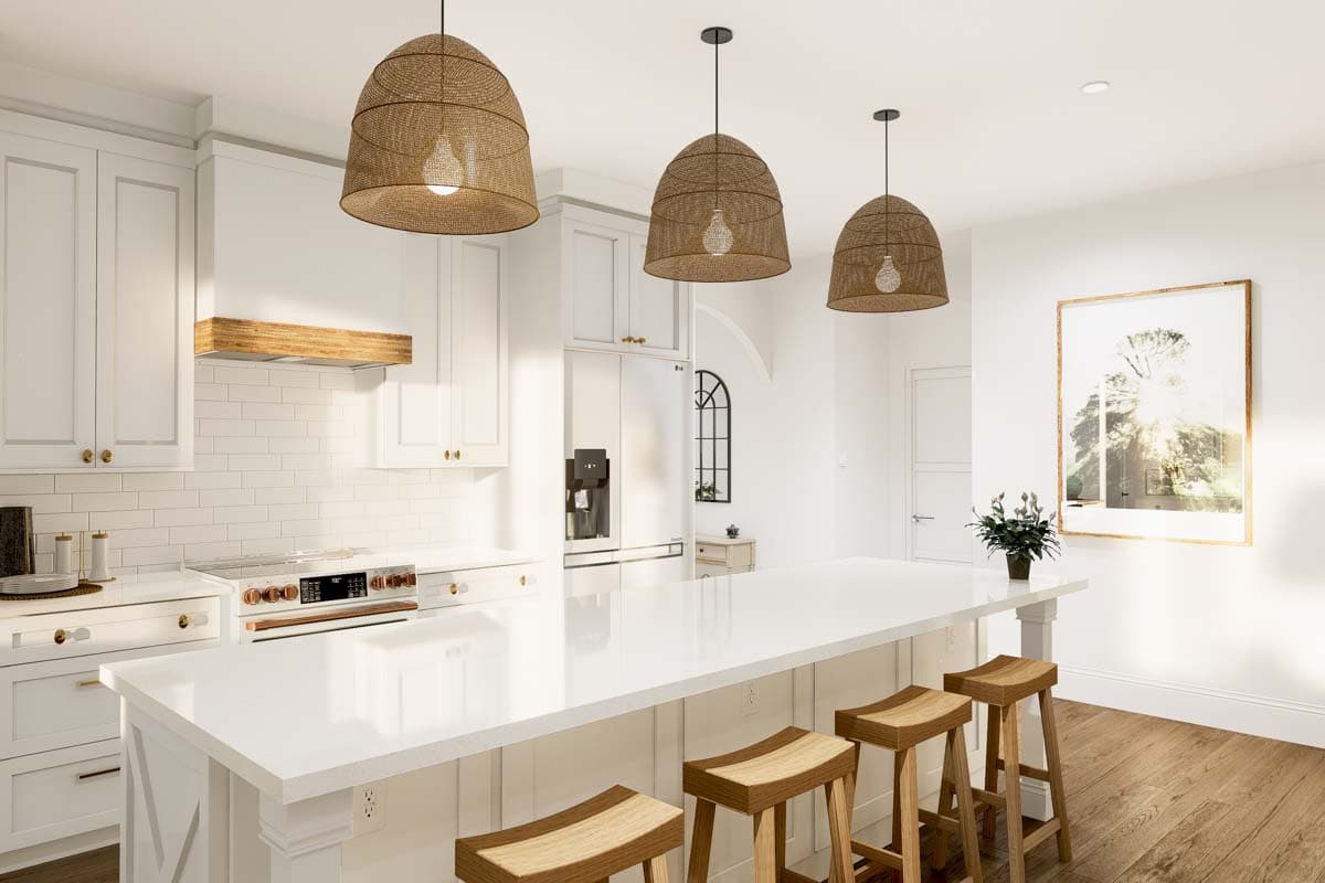 Kitchen interior with white cabinets, subway tile backsplash, range, island with seating, and woven pendant lights.