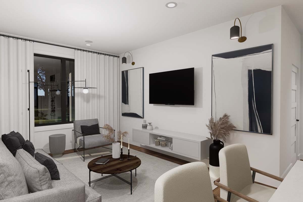 Living room with floating media console, wall-mounted TV, contemporary armchairs, sofa, and floor lamp.