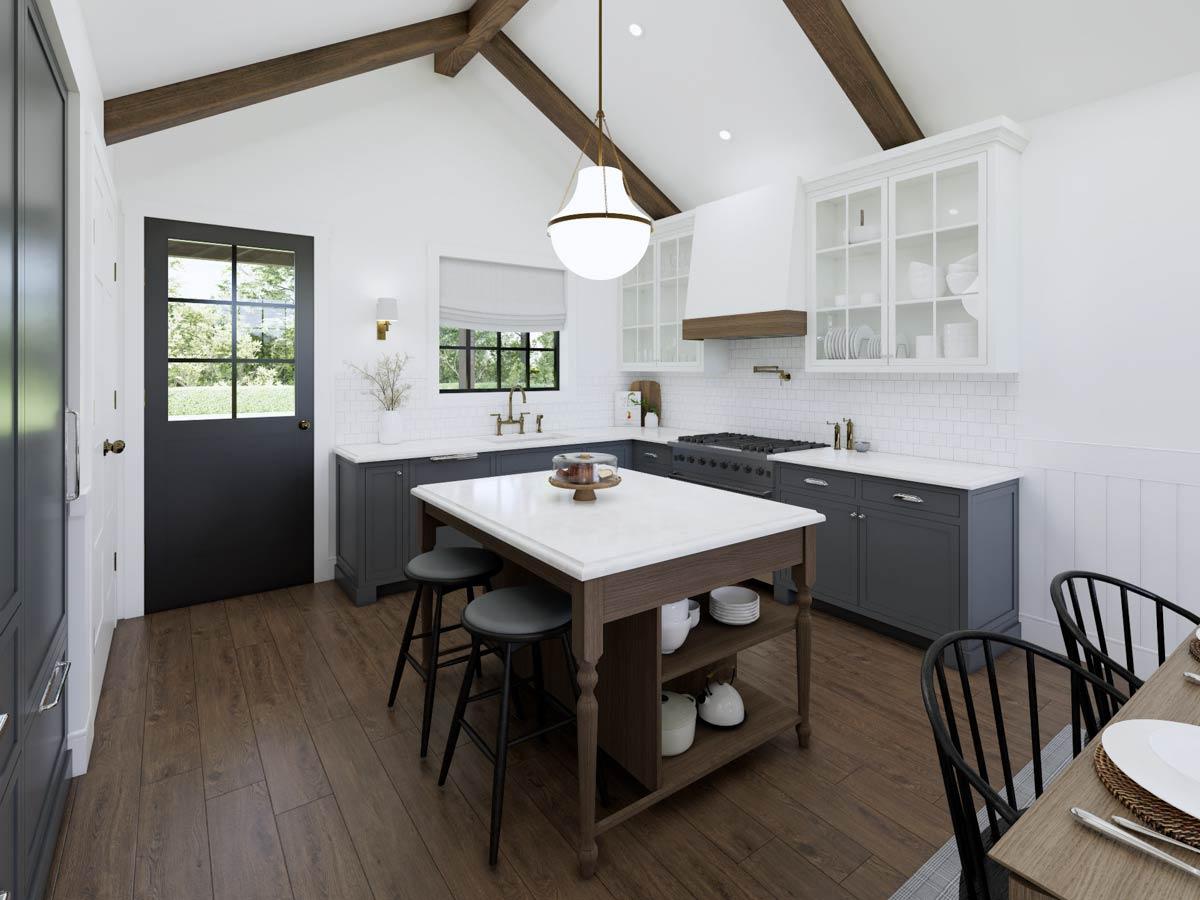 Spacious, modern kitchen with dark gray cabinets, white countertops, and a large island with bar stools. A cake sits on the island.