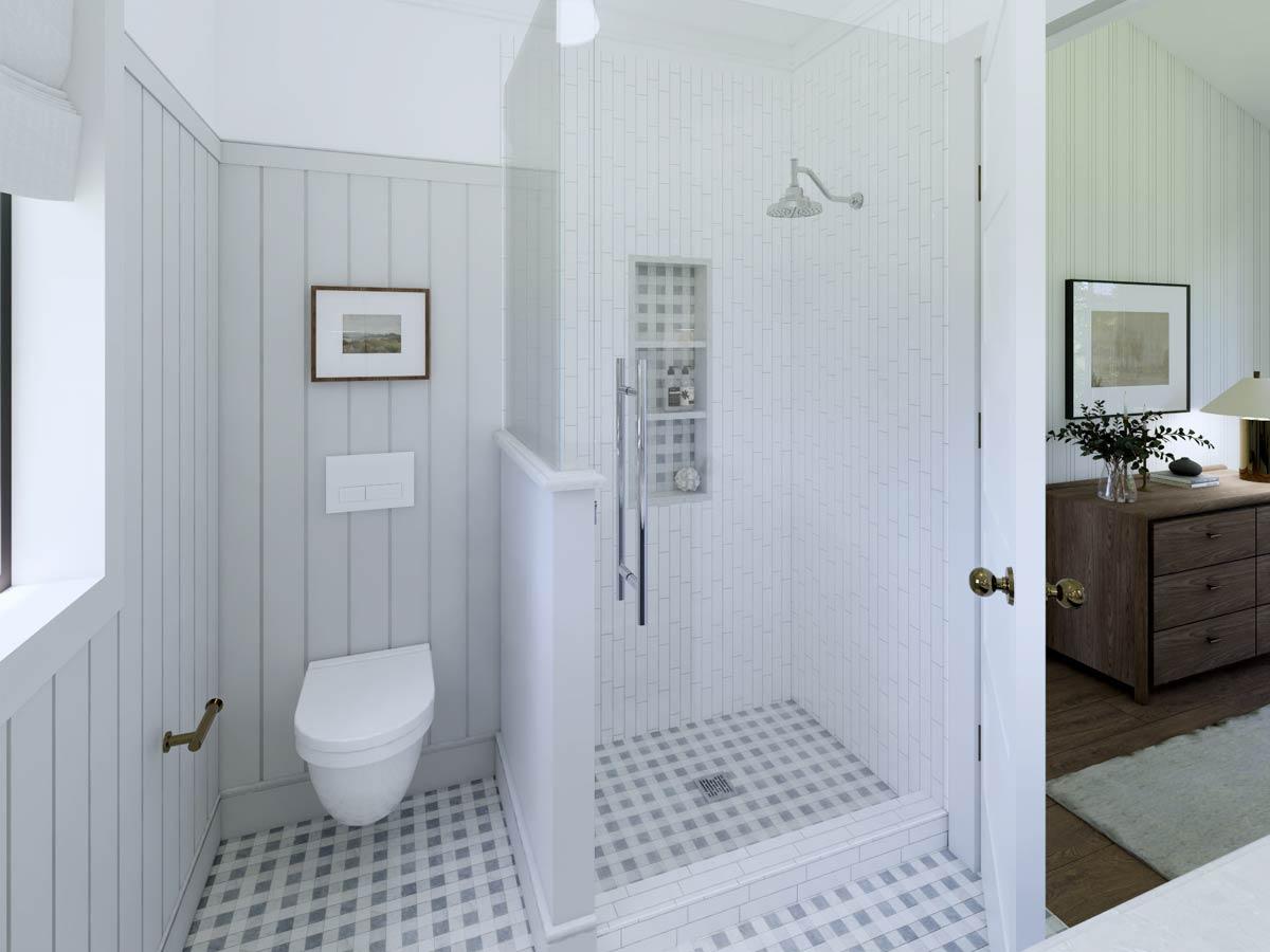 A modern, minimalist bathroom with a glass-enclosed shower, a wall-mounted toilet, and a framed landscape picture. The room is light and airy.