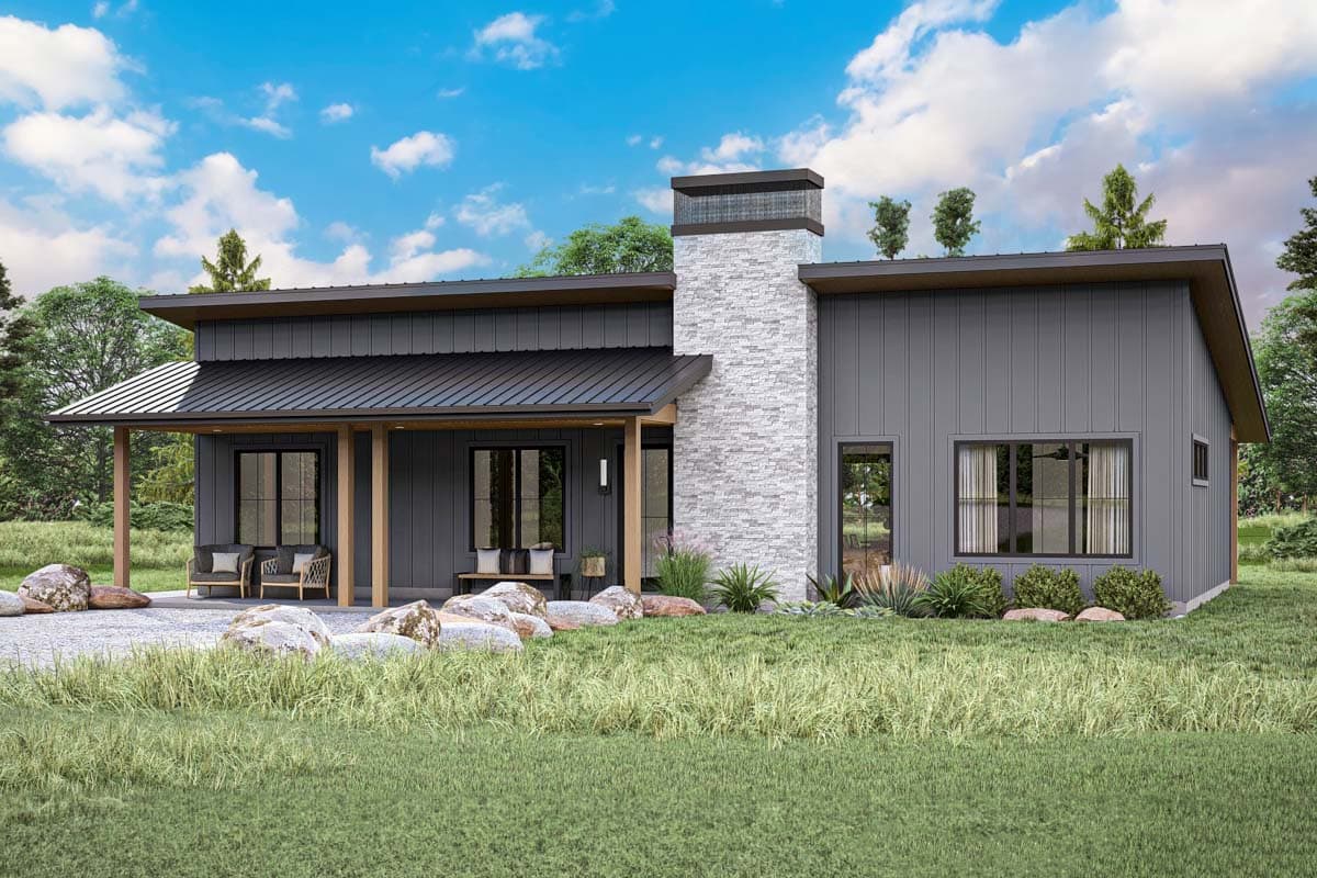 House plan exterior. Modern style, single story. Features include a covered porch, flat roof, and stone chimney. Gray siding.