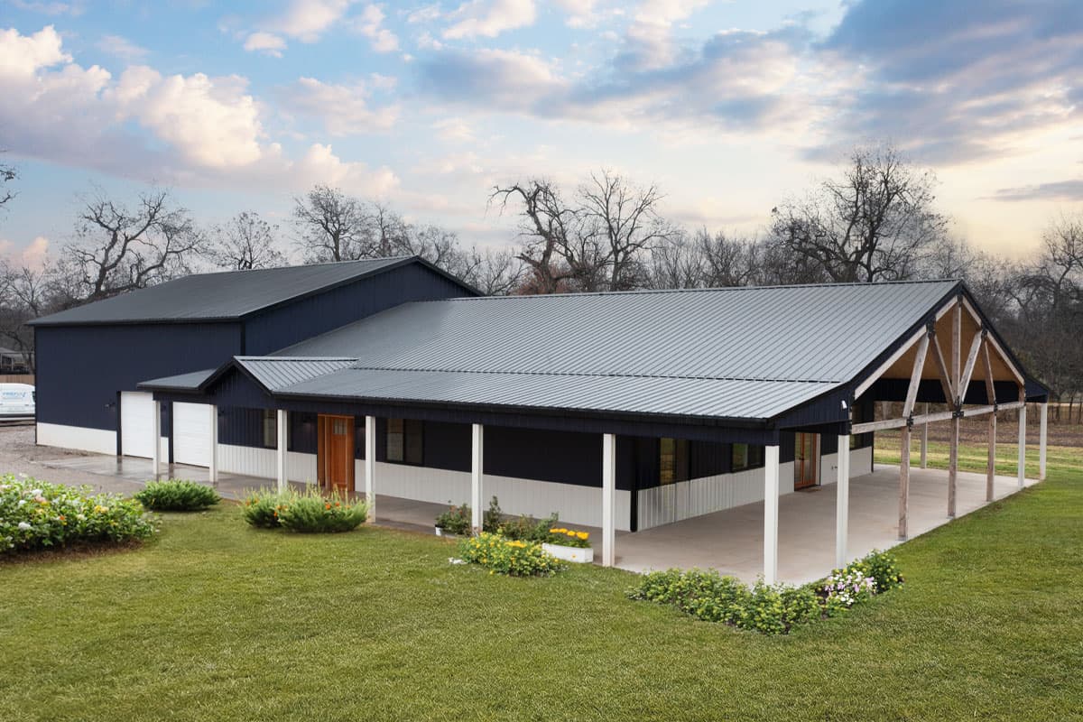 House plan exterior. Two-story structure with gable rooflines and a covered porch. Features include a metal roof, and attached garage.