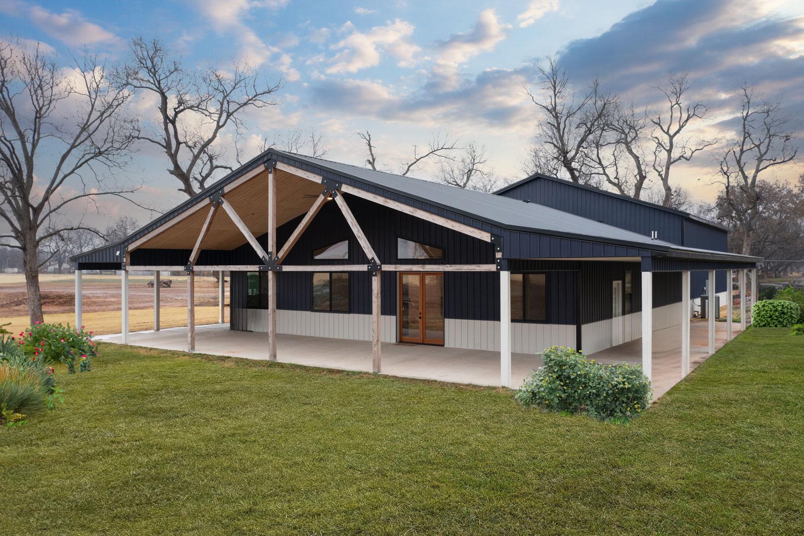 House plan exterior with a gambrel roof, exposed wood beams, large covered porch, and dark vertical siding.