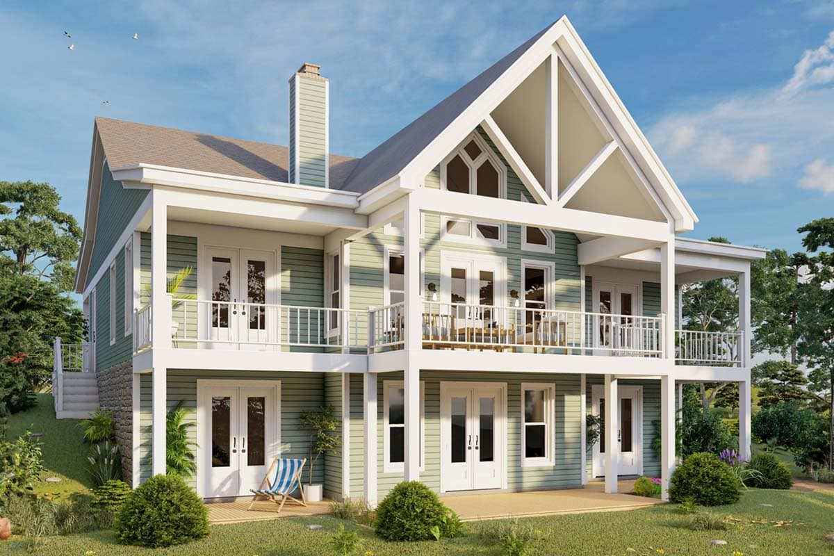 House plan exterior with two stories, covered porches, gabled roof, and a prominent gable end. Green siding and white trim are visible.