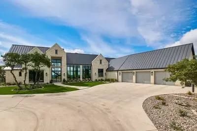 Contemporary Hill Country House Plan with Courtyard Garage and Outdoor Kitchen