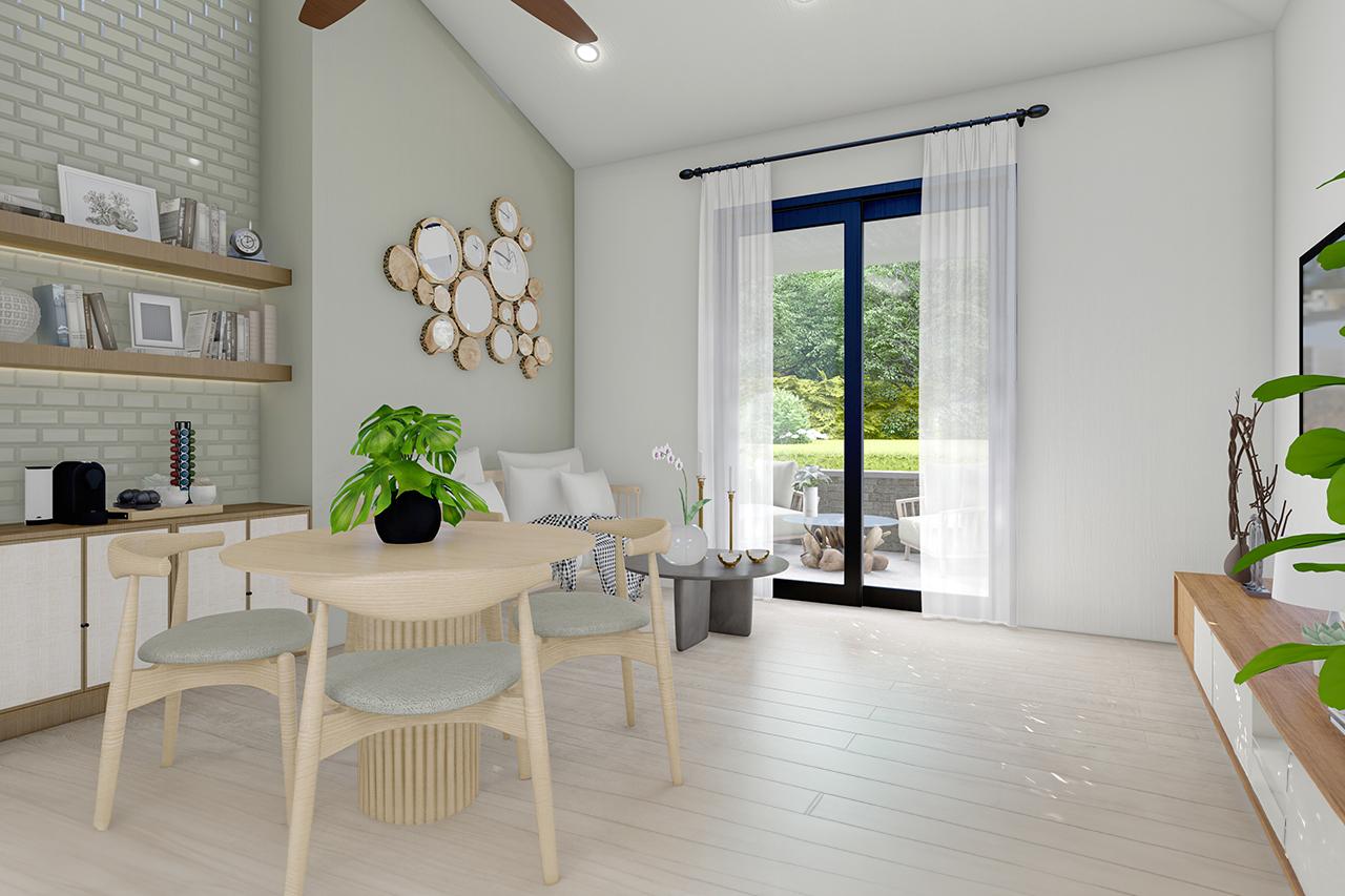 Open concept living area with dining table, seating area, vaulted ceiling, and sliding glass doors to patio.