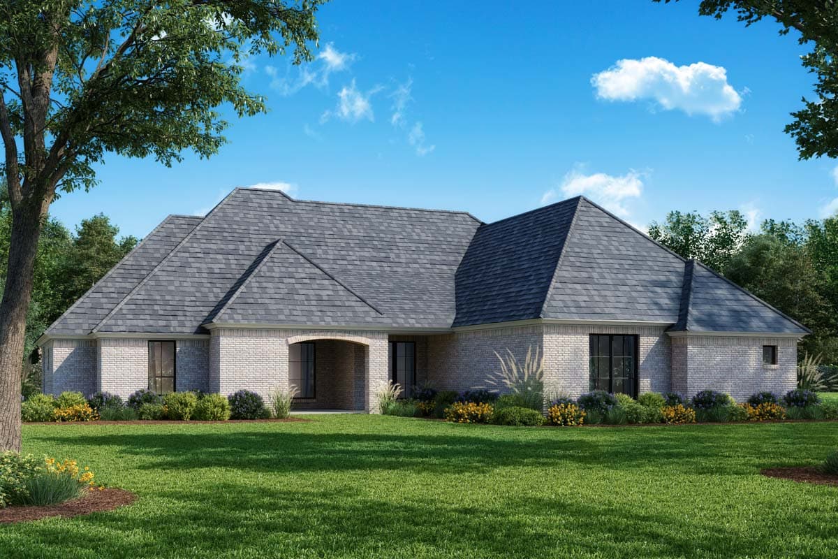 House plan exterior with brick facade, arched entry, and multiple gables. One story, with dark-shingled roof.
