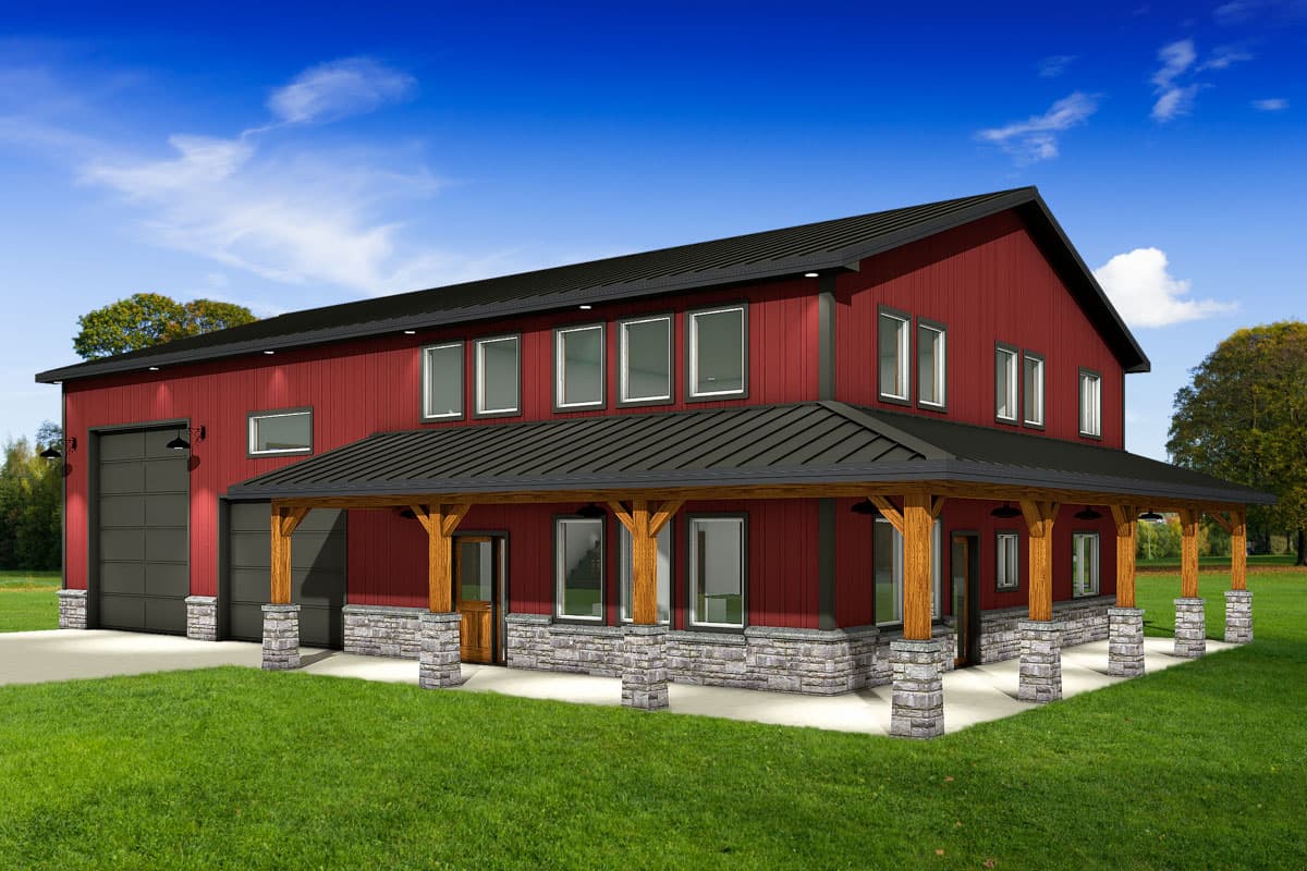 A two-story red barn-style house with a covered porch and garage doors sits on a green lawn against a blue sky.