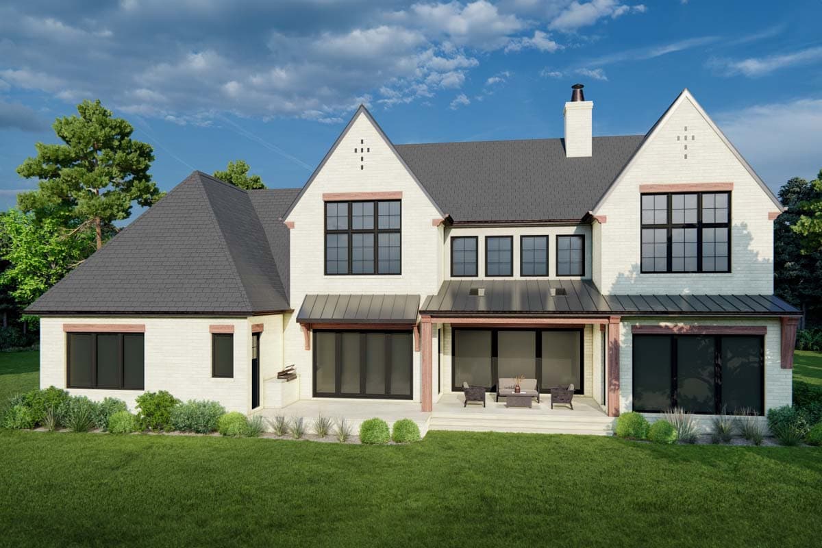 House plan exterior: two-story brick home with gabled roofs, dark windows, and covered patio.