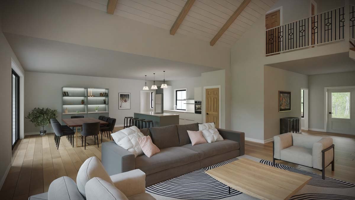 Open-concept living area with vaulted ceiling, exposed beams, island kitchen, dining area, and balcony overlook.