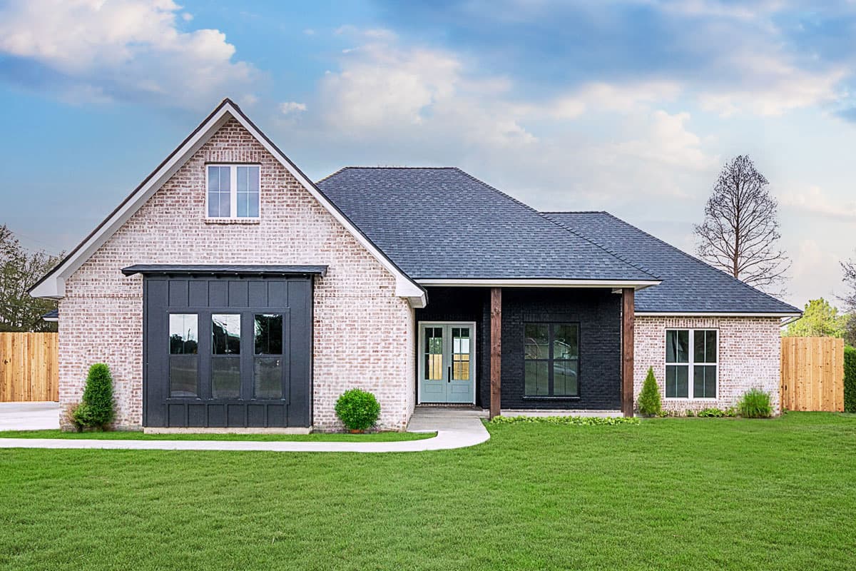 House plan exterior with brick facade, gable roof, and covered porch with dark wood columns and matching black window frames.
