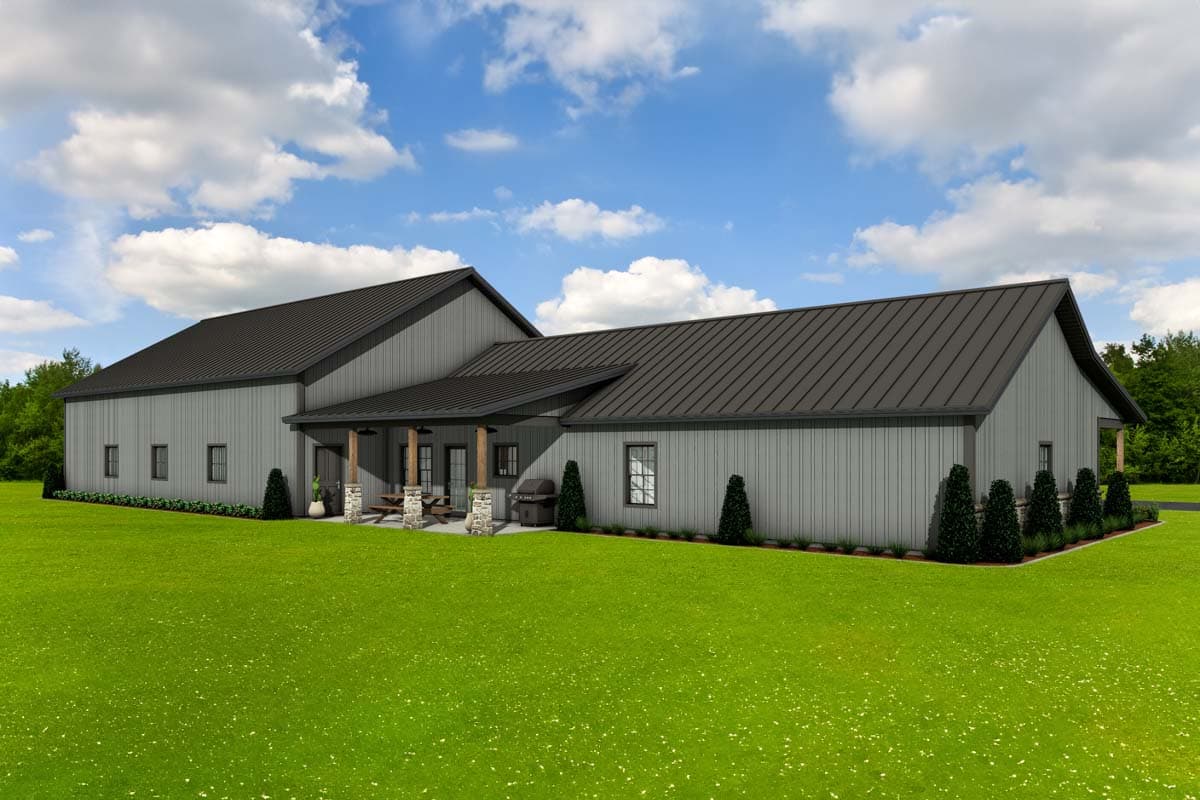 House plan exterior: Modern barndominium style, single story, with a covered porch, gabled roof, and vertical siding.
