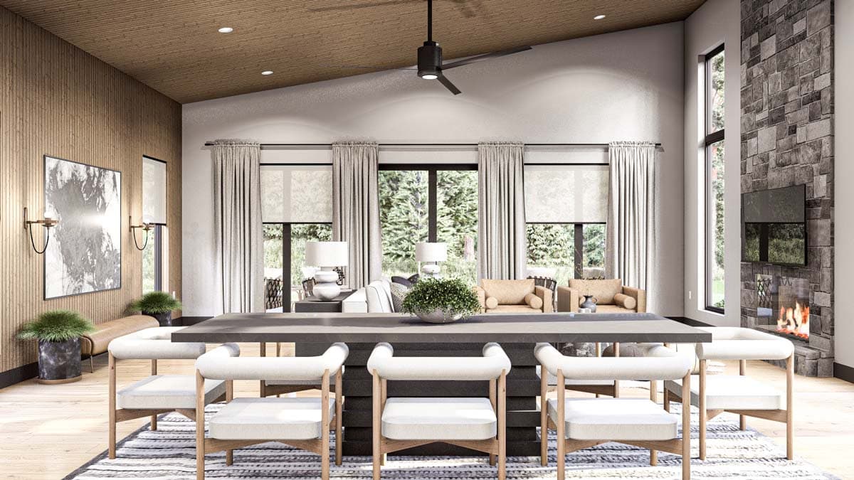 Interior rendering of a great room with vaulted, wood-paneled ceiling, stone fireplace, large windows, and dining area.