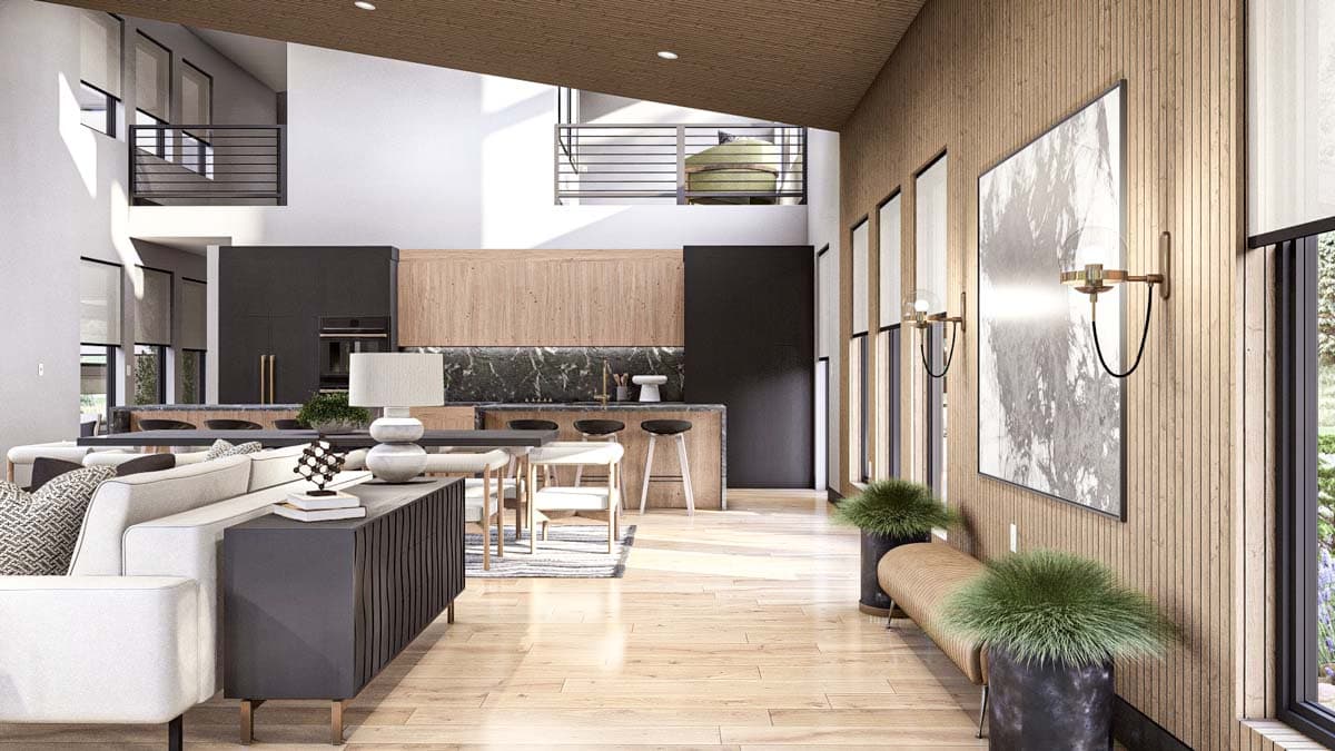 Interior view showing open-plan living area with kitchen, dining, and seating areas, vaulted ceiling, and wood paneling.
