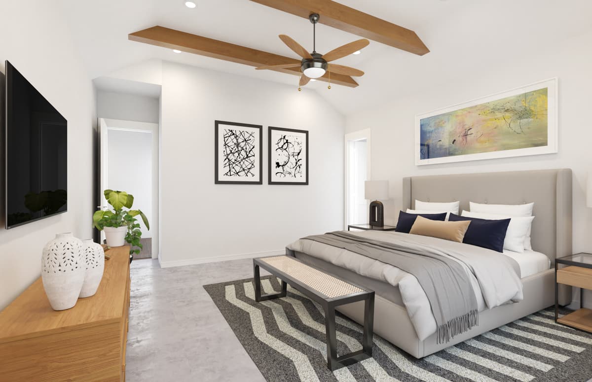 Bedroom interior with vaulted ceiling, exposed beams, king bed, modern art, and television.