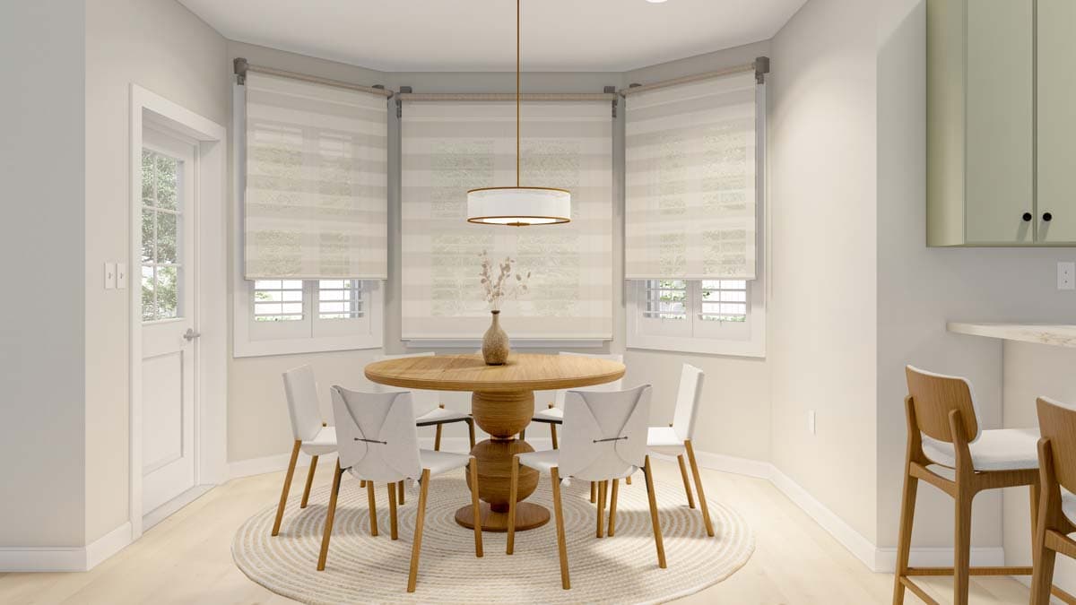 Dining area with round wooden table, white chairs, and bay windows with striped blinds.