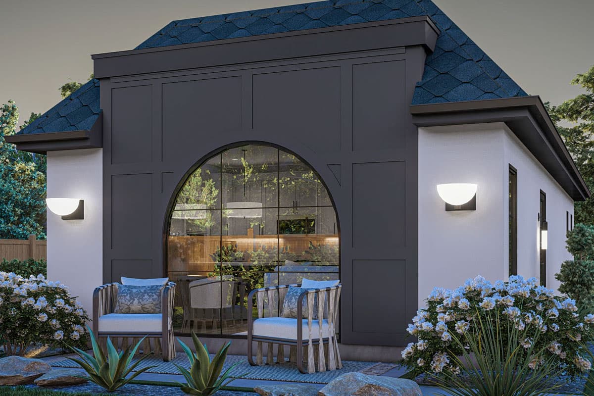 House plan exterior with arched window, dark paneled section, and dual-pitched roof.