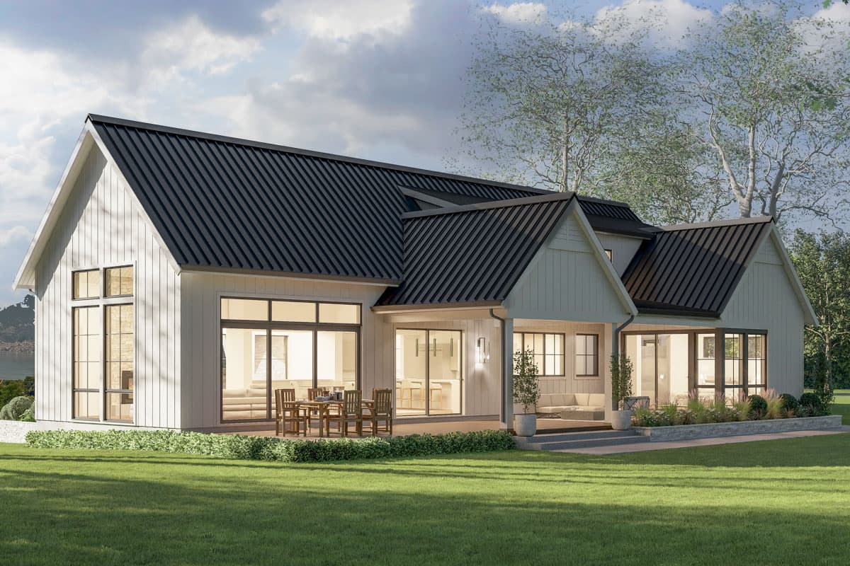 Modern Farmhouse house plan exterior with gabled dormers, large windows, a covered patio, and a metal roof.