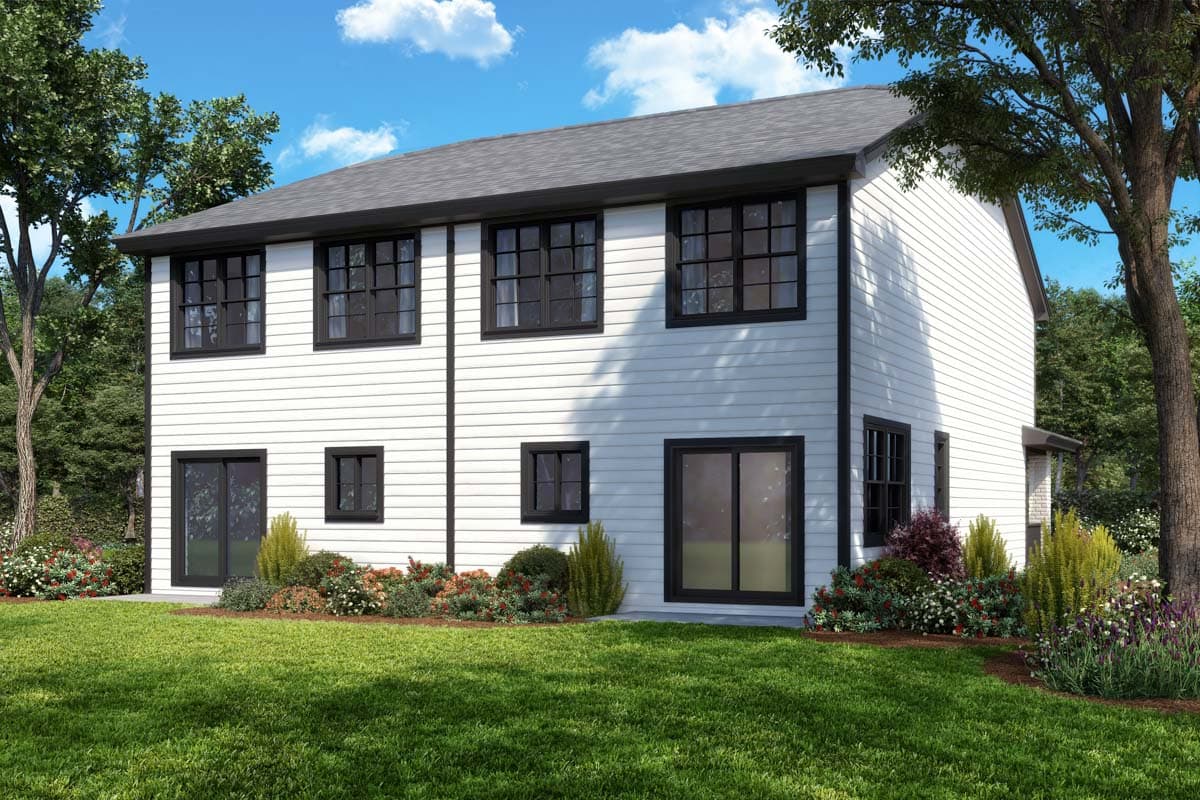 Two-story house plan exterior with white siding, black-trimmed grid windows, and a dark roof.
