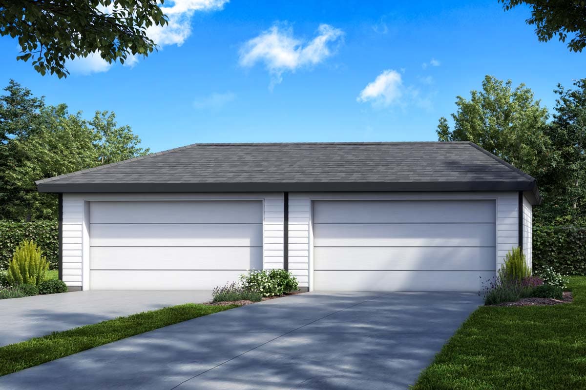 Two-car garage exterior with white horizontal siding, dark gable roof, and two white garage doors.