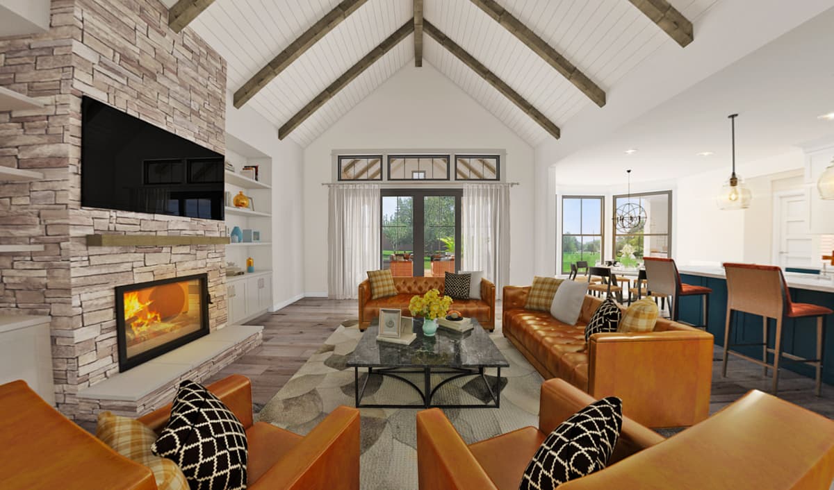 Open-concept great room with stone fireplace, vaulted ceiling with exposed beams, and bar seating.