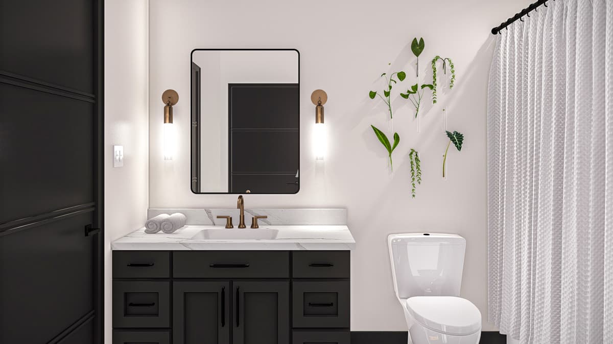 Modern bathroom with dark vanity, marble countertop, vessel sink, brass faucet, wall sconces, and white shower curtain.