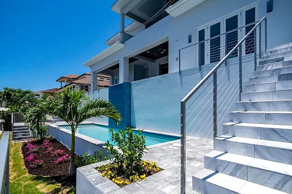 Plan 31857DN: Two-Story Coastal Beach House Plan with Two-Story Great Room - 5102 Sq Ft - Image #4 - Coastal, Coastal Contemporary, Florida-Style