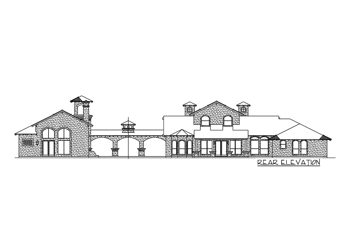 Rear elevation house plan showing a stucco-clad house with a covered walkway, multiple gables, arched windows, and a tower element.