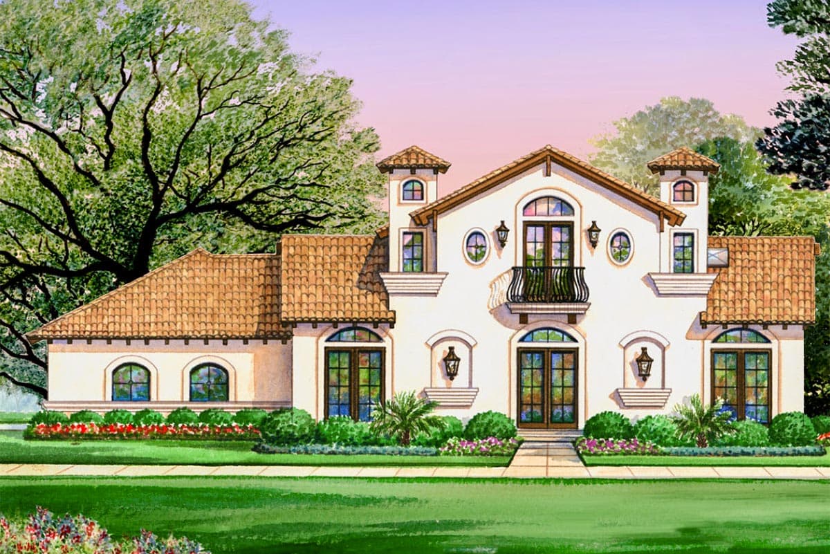 Mediterranean style house plan exterior with tile roof, arched windows, balconies, and a prominent tower.