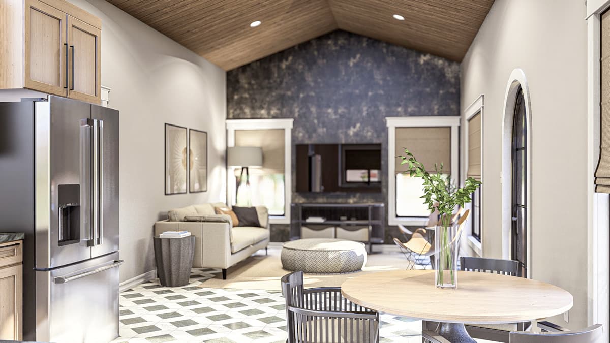 Open concept living area with vaulted wood ceiling, kitchen, dining, and living room with fireplace.