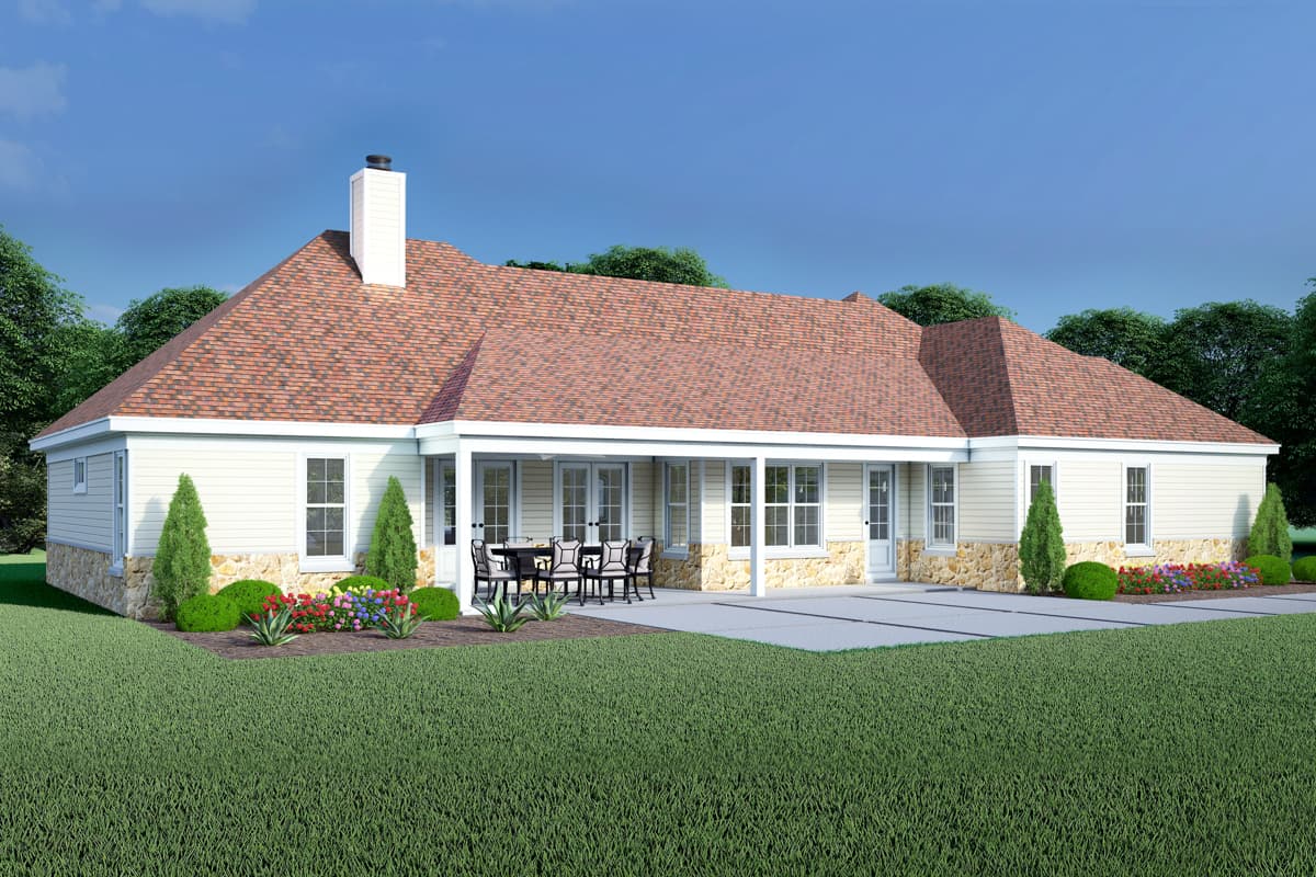 House plan exterior: One-story home with stone foundation, covered patio with outdoor dining, and hip rooflines.