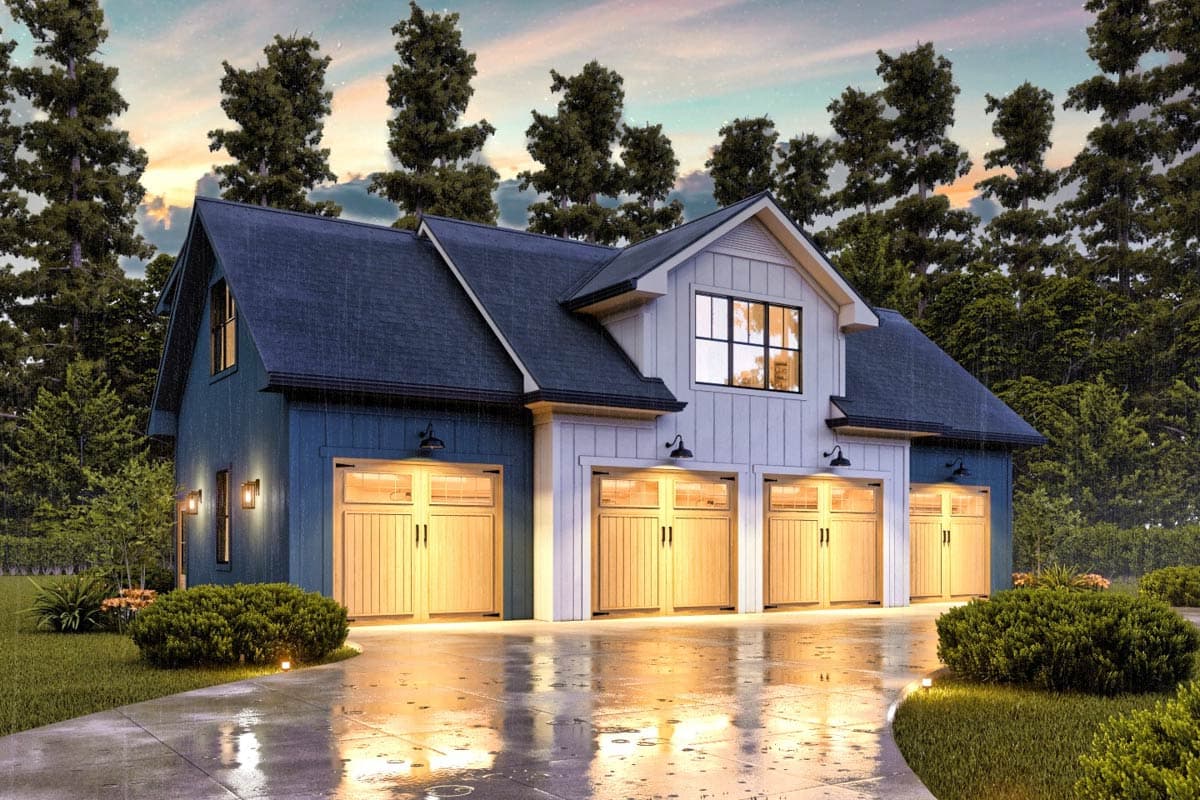 Exterior shot of a modern farmhouse garage in the rain. Blue siding, light wood garage doors, and lush greenery.