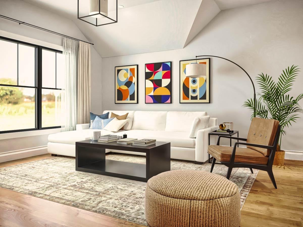 Modern living room with white sofa, abstract art, brown chair, and a woven ottoman. Large window with field view.