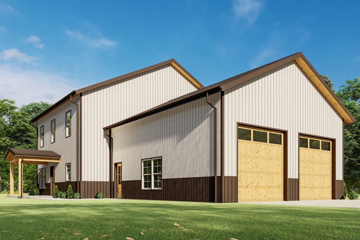 Metal building exterior with two garage doors, a covered entrance, and multiple windows. Two stories visible.
