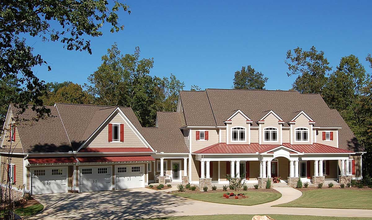 House plan exterior: Two-story Modern Farmhouse with three-car garage, prominent gables, dormers, and a wraparound porch.