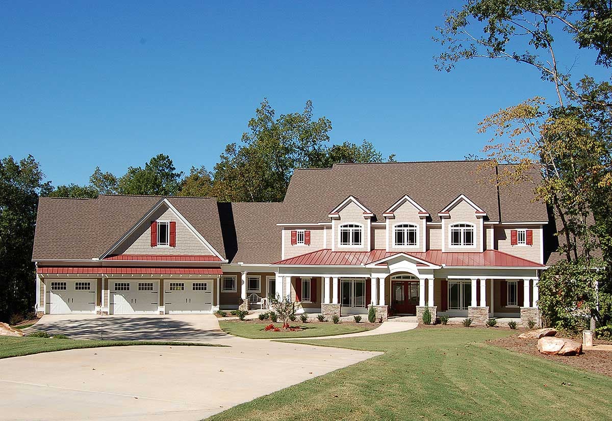 House plan exterior featuring a multi-story home with a wraparound porch, dormers, and a three-car garage.