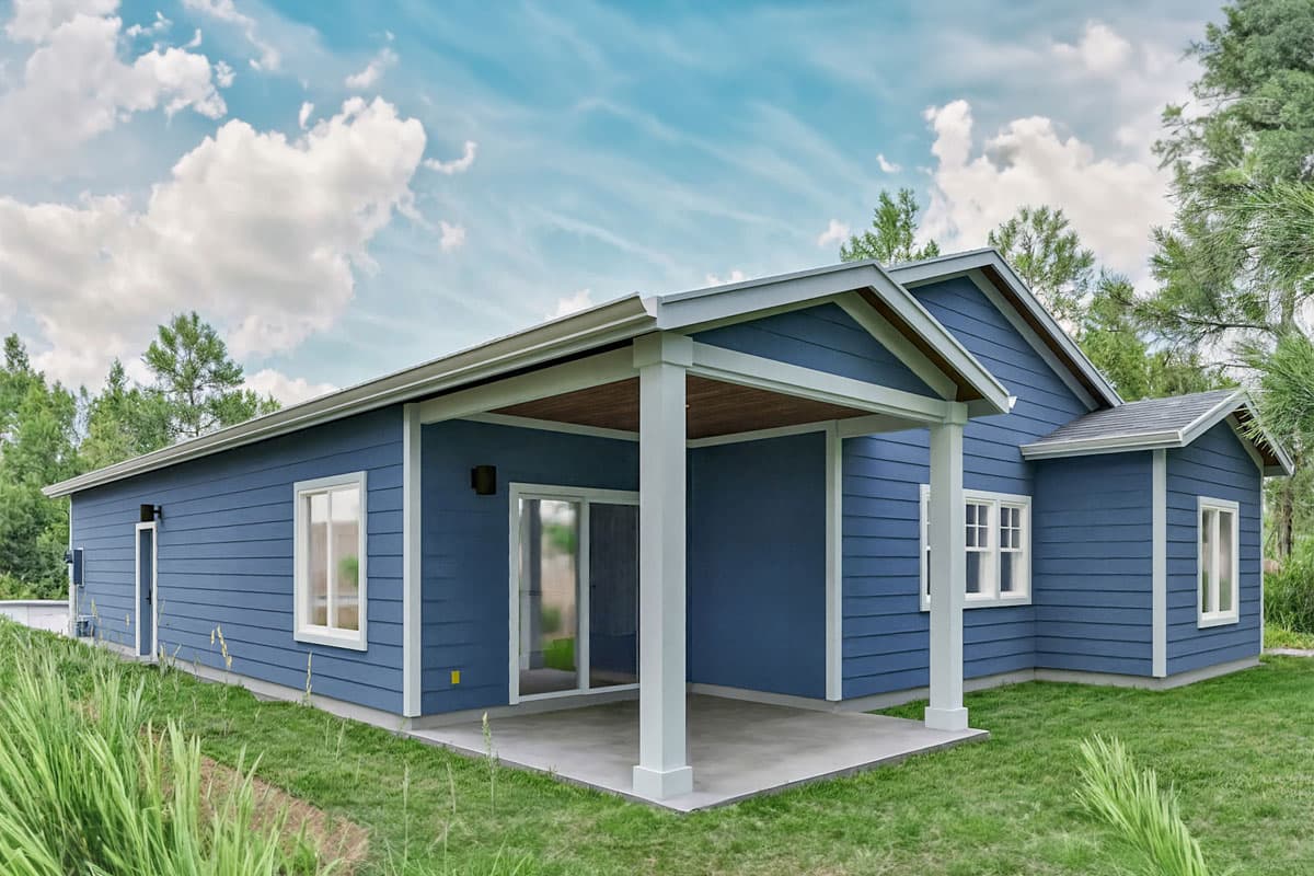 House plan exterior: Single-story Modern Farmhouse with a covered porch, gabled rooflines, and horizontal siding.