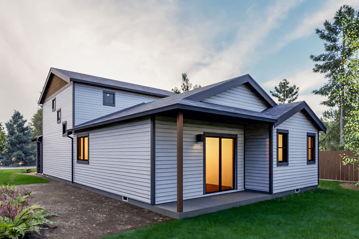 House plan exterior: Two-story contemporary home with vinyl siding, covered porch, and gabled rooflines.