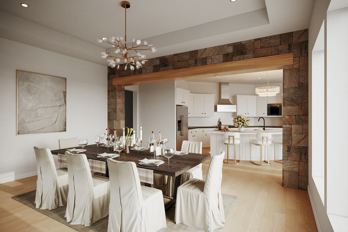Dining area with stone accent wall and wooden beam leading to a white kitchen with island and bar stools.