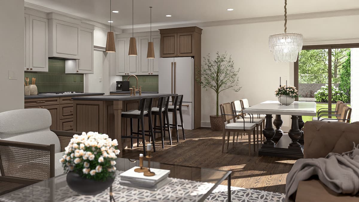 Open concept kitchen and dining area with island, pendant lights, dining table, and patio doors to backyard.