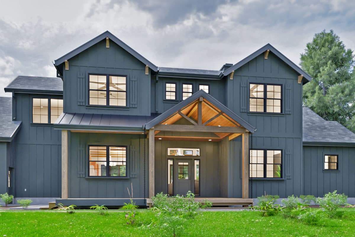 Modern Farmhouse house plan exterior with multiple gables, board and batten siding, and exposed timber porch roof.