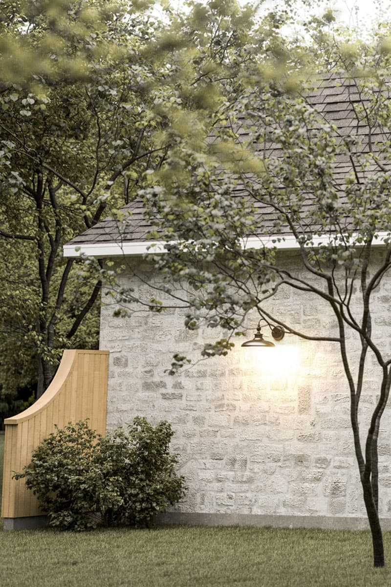 House plan exterior: stone wall, pitched roof, ornamental tree, and curved wooden panel.