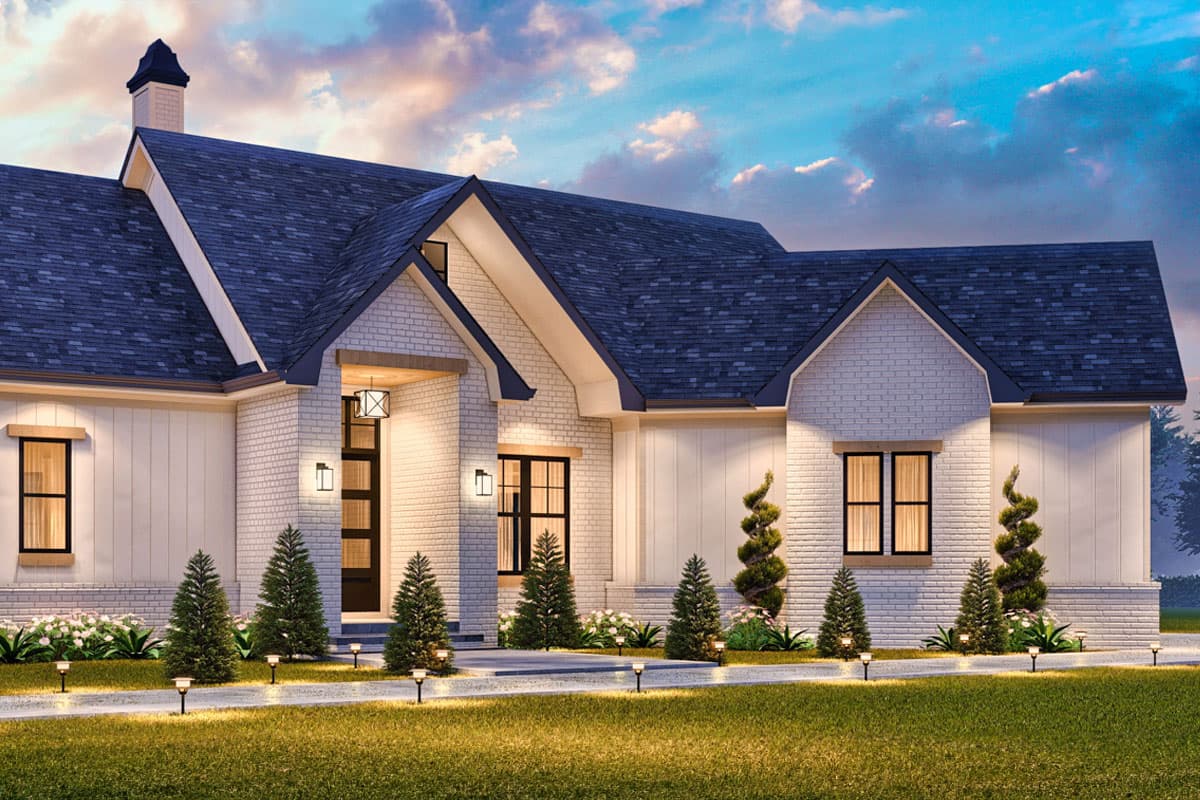 Modern Farmhouse house plan exterior with brick facade, board and batten siding, prominent gables, and covered entryway with lighting.