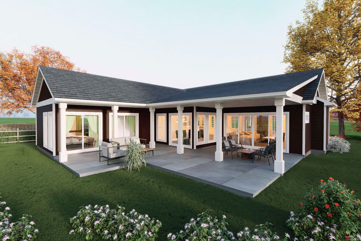 One-story house plan exterior with L-shaped covered patio, dark siding, white trim, and many windows.
